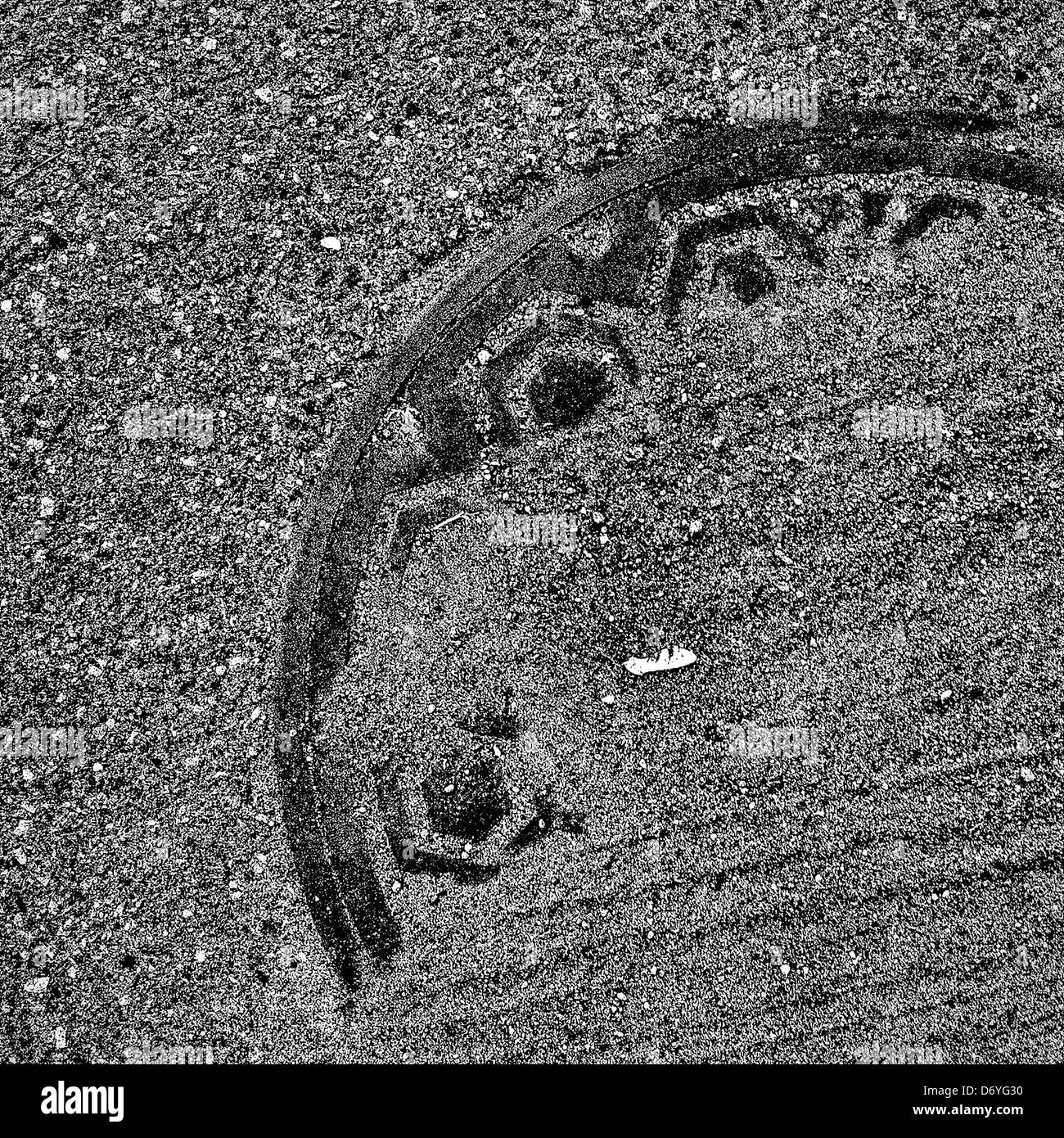 Manhole cover underneath dirt - Smartphone Captured Stock Image