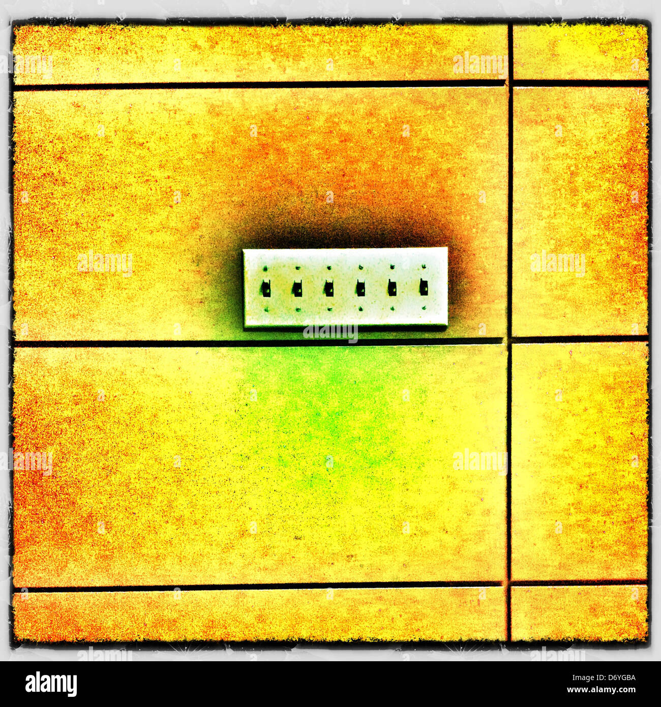 Row of light switches in yellow wall - Smartphone Captured Stock Image