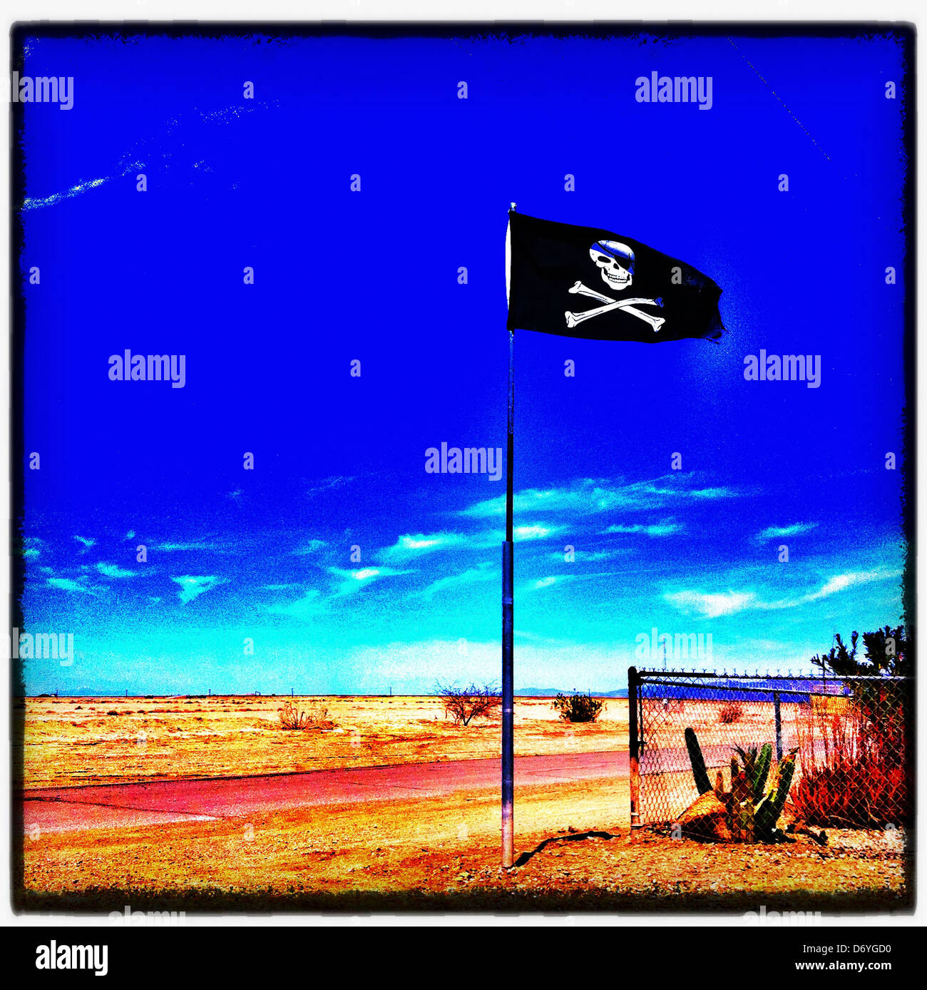 Pirate flag against blue sky, Niland, California, United States - Smartphone Captured Stock Image