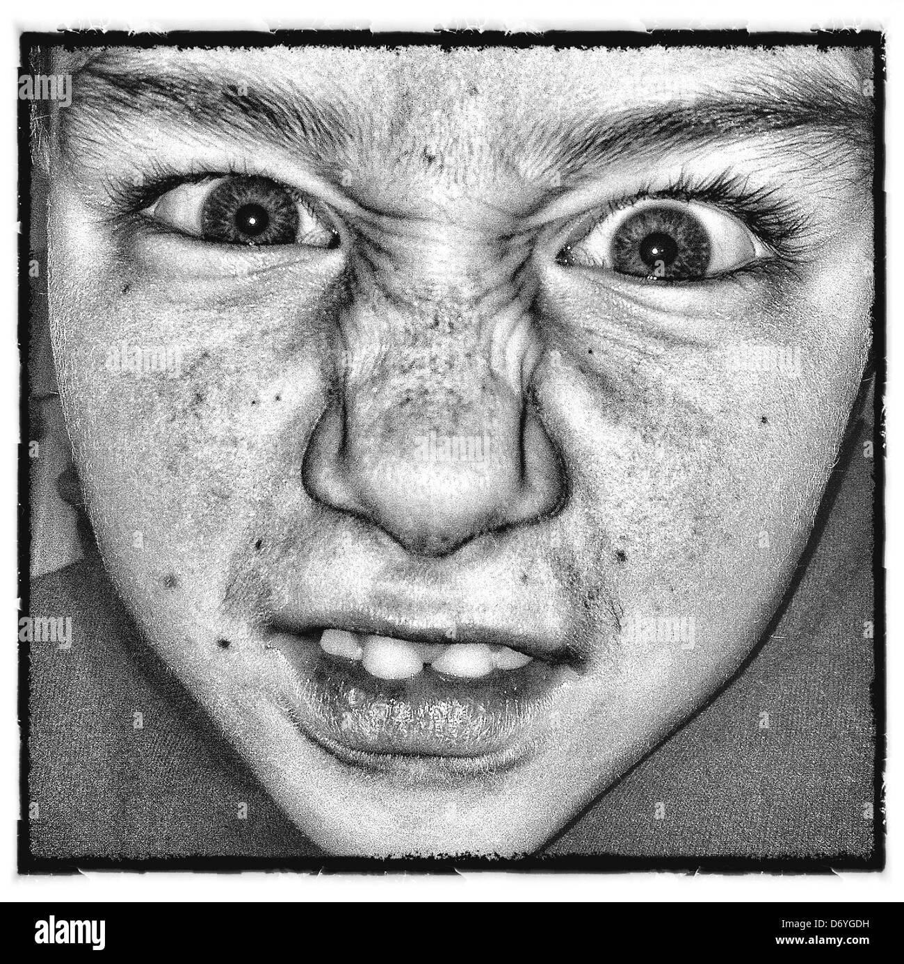 Grimacing Caucasian boy - Smartphone Captured Stock Image