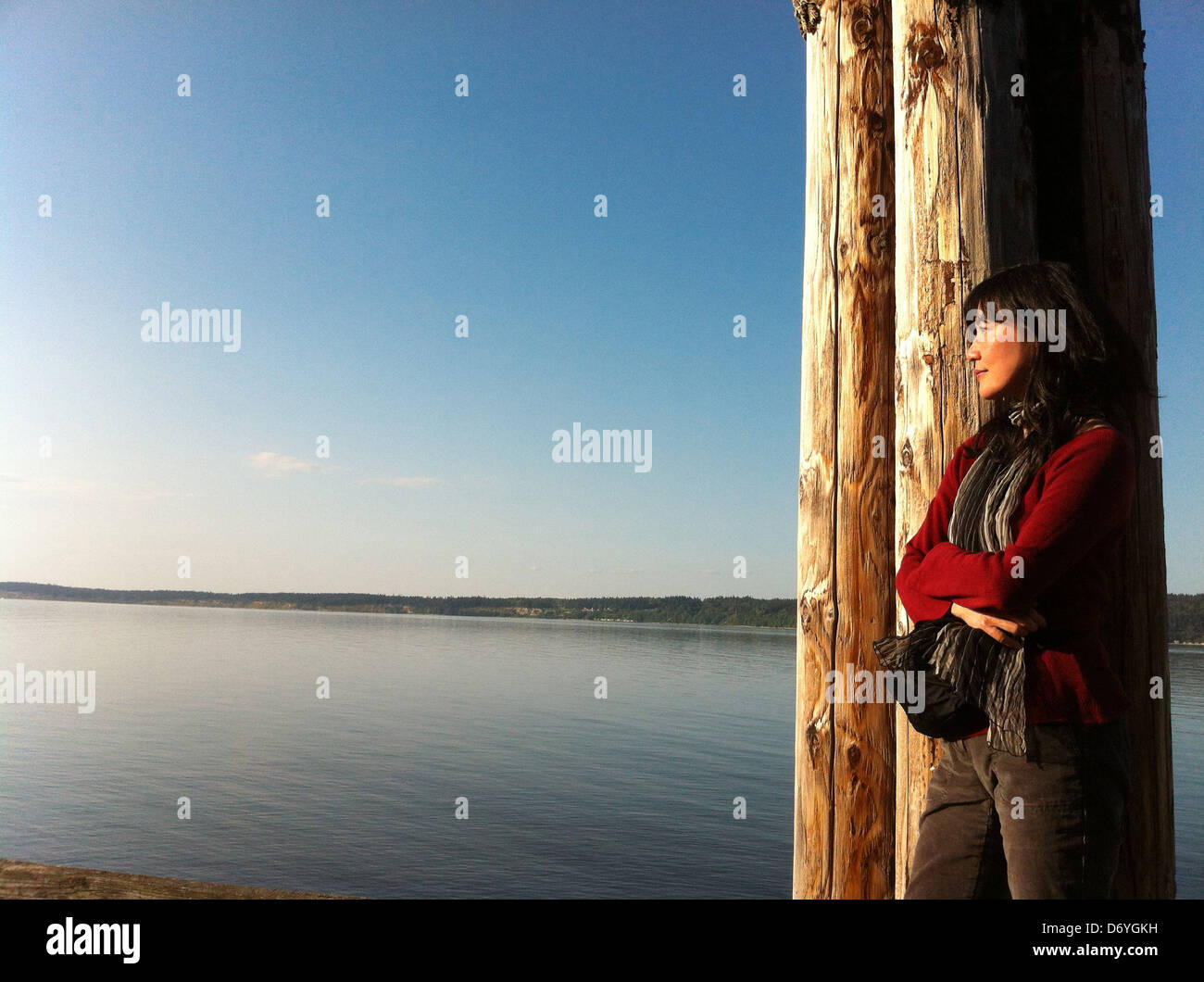 Japanese woman looking at lake, Whidbey Island, Washington, United States - Smartphone Captured Stock Image