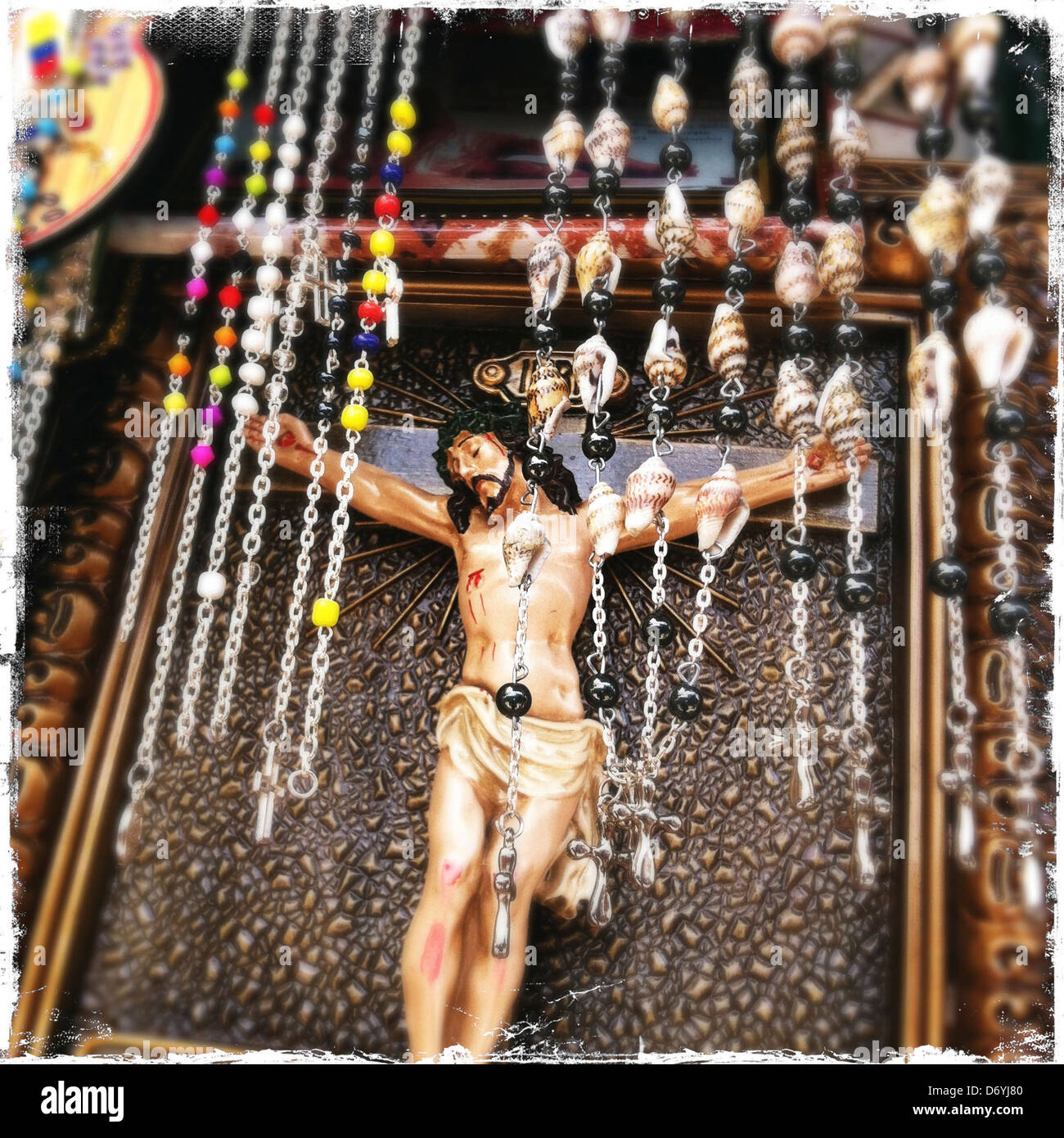 Crucifix behind rosaries - Smartphone Captured Stock Image