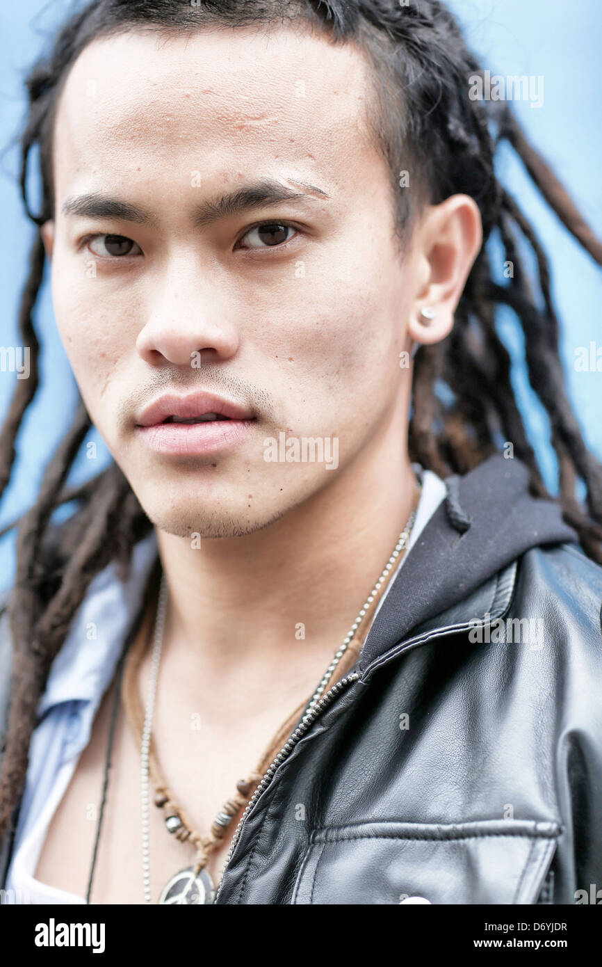 Serious Chinese man with dreadlocks - Smartphone Captured Stock Image