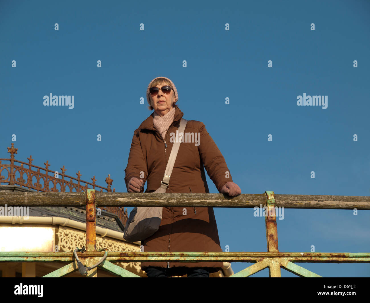 Woman leaning against railings hi-res stock photography and images - Alamy