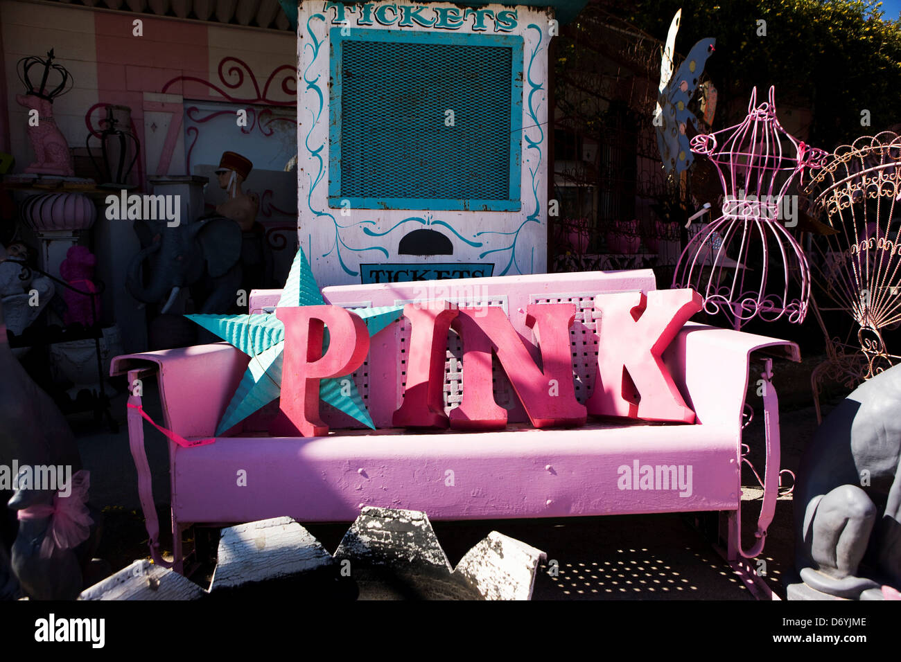 Letters Spelling Out The Word Pink On A Vintage Iron Bench At A