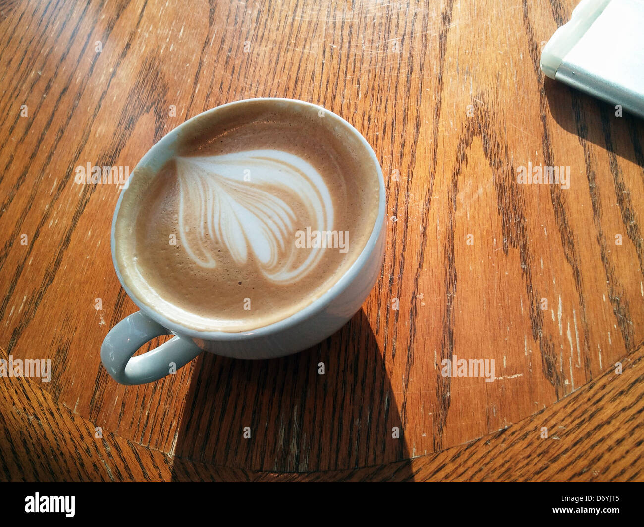 Decorative foam on top of coffee cup - Smartphone Captured Stock Image