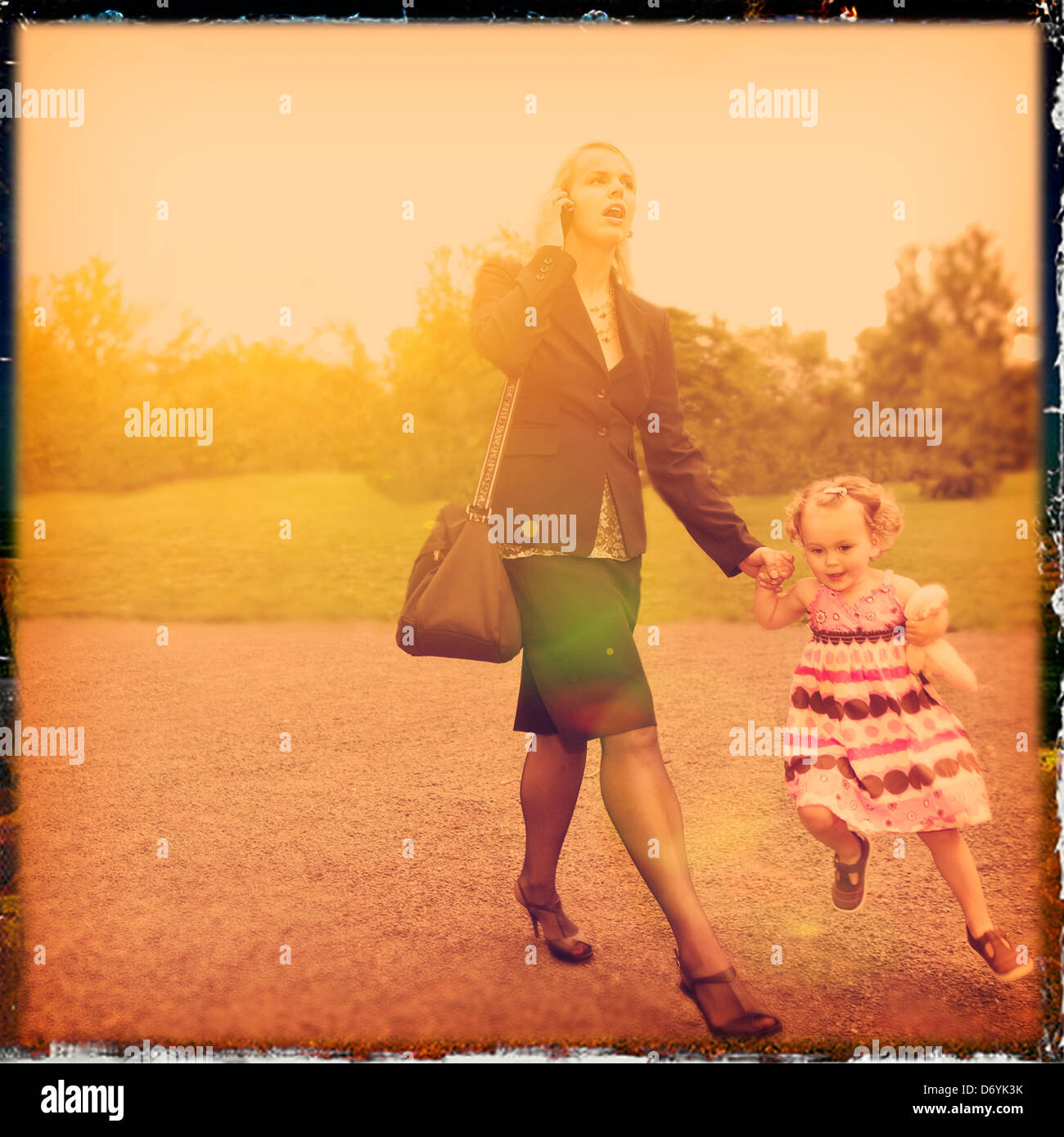 Caucasian mother and daughter walking and holding hands - Smartphone Captured Stock Image
