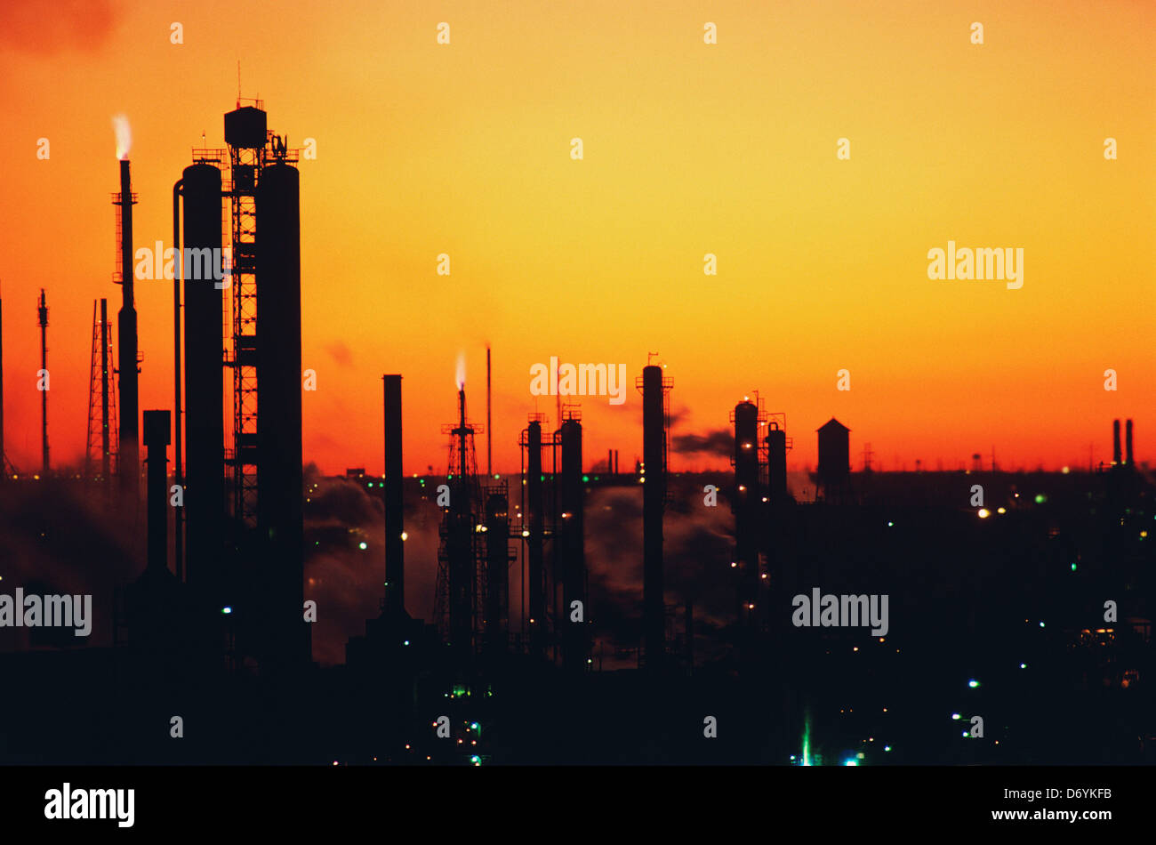 Silhouette of an oil refinery at sunset, Texas, USA Stock Photo - Alamy