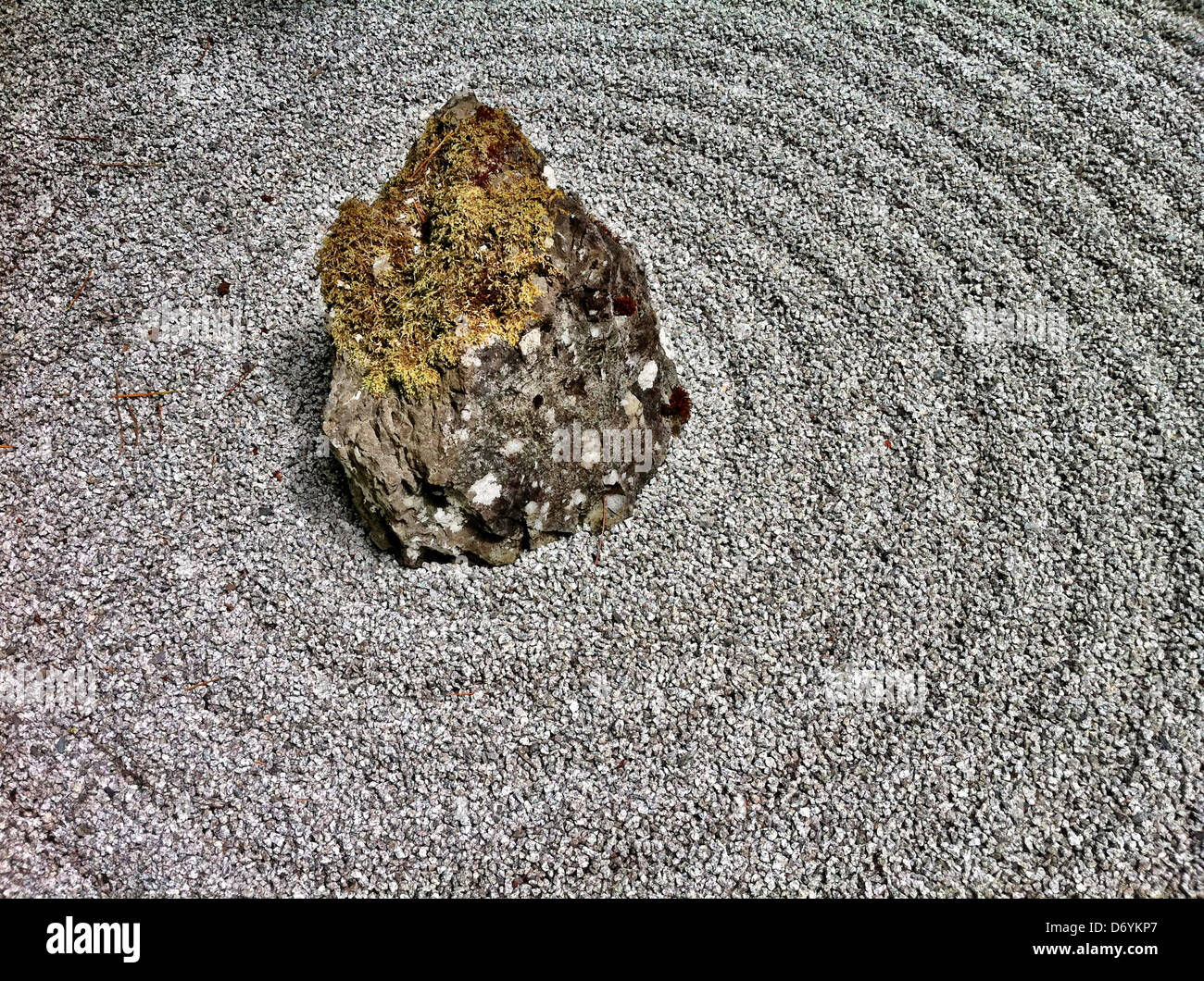 Rock in neatly combed gravel garden - Smartphone Captured Stock Image