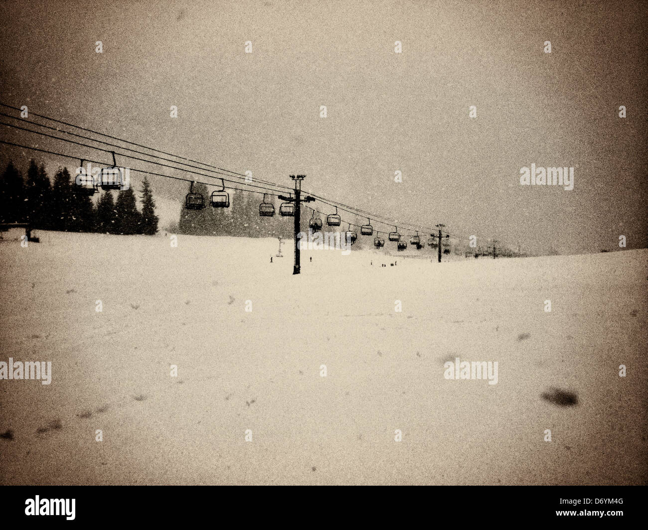 Chairs on ski lift over snowy landscape, Seattle, Washington, United States - Smartphone Captured Stock Image