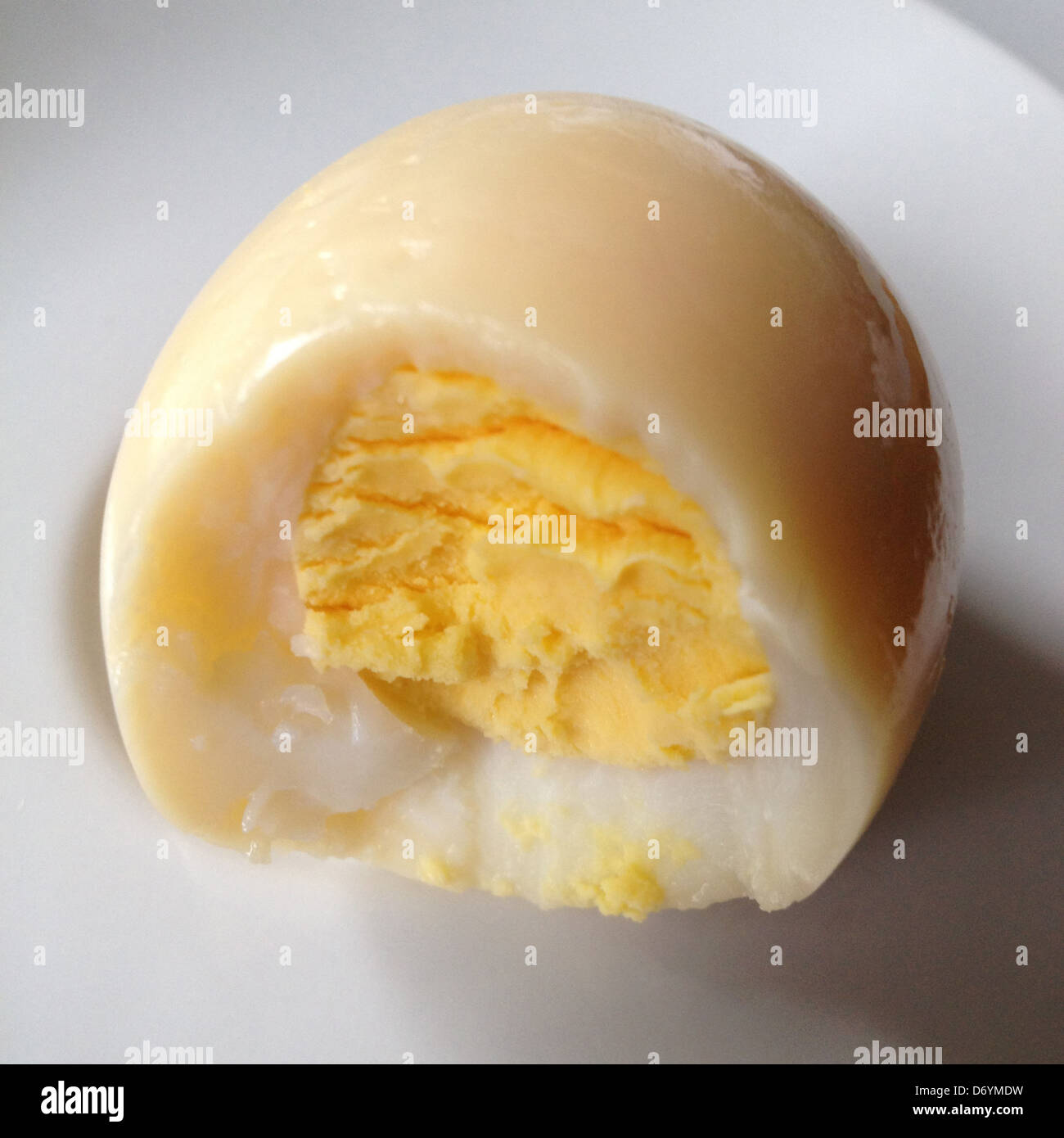 Close up of bite of hard boiled egg - Smartphone Captured Stock Image