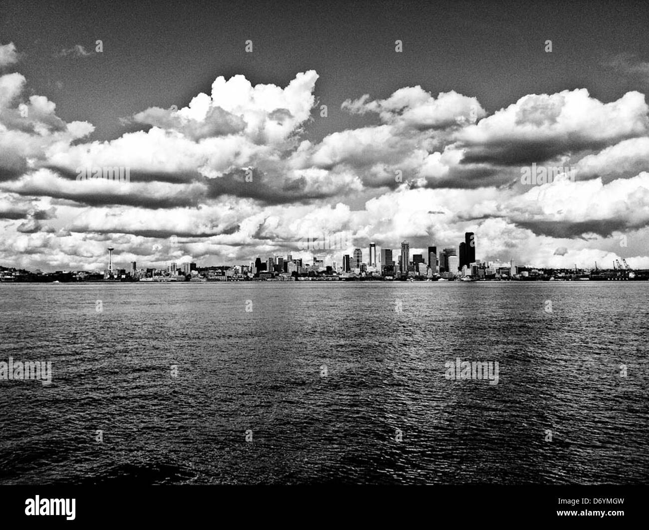 Dramatic clouds over city skyline, Seattle, Washington, United States - Smartphone Captured Stock Image