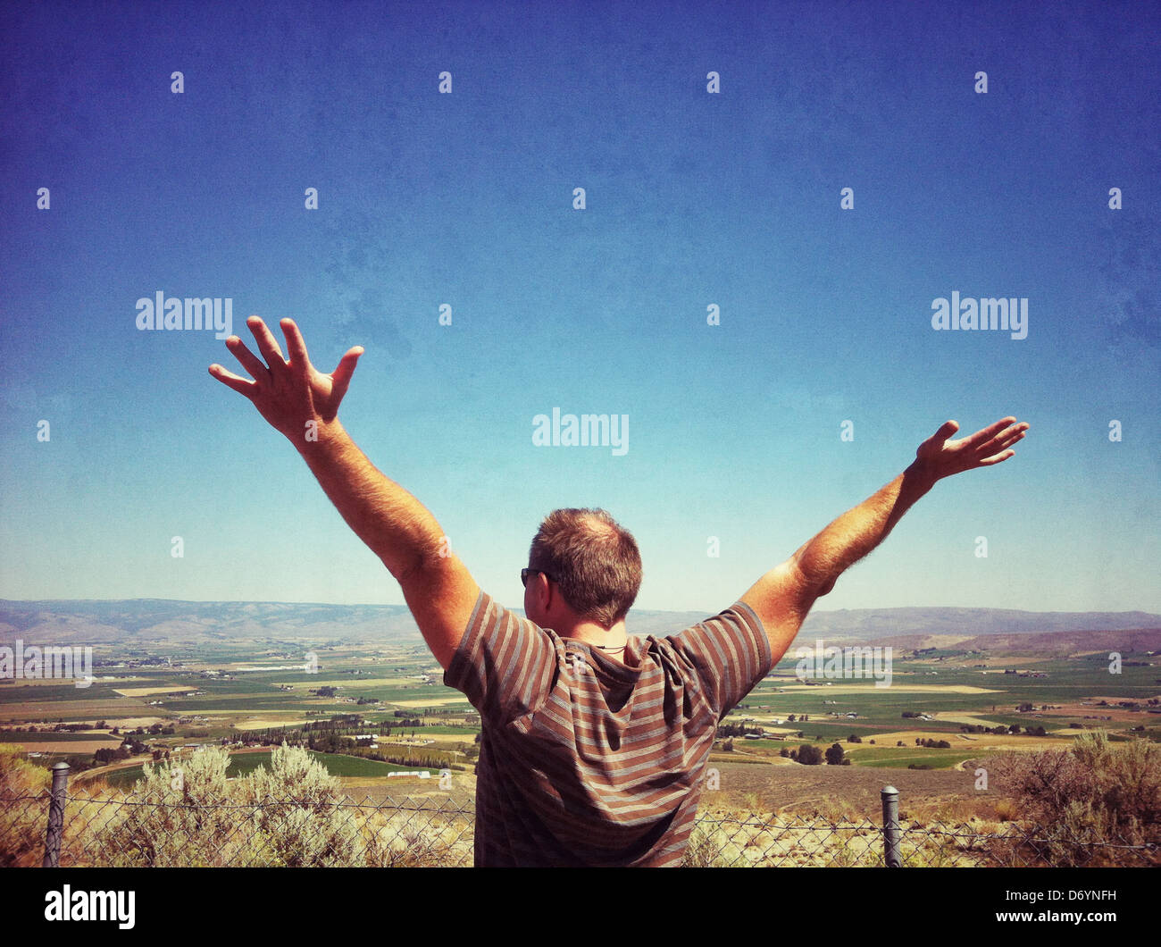 Caucasian man overlooking rural landscape, Ellensburg, Washington, United States Stock Photo