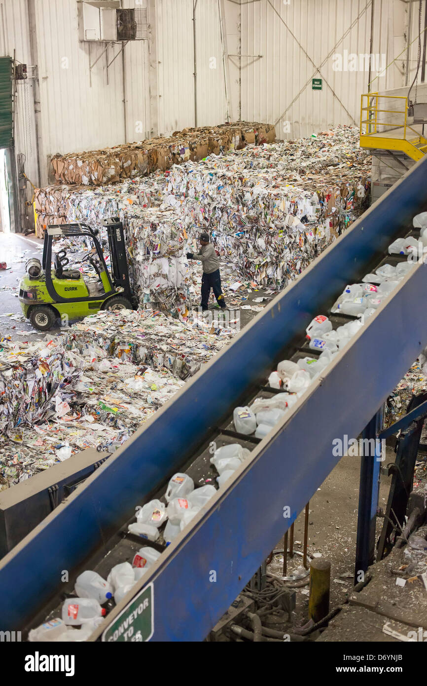 Workers sort materials for recycling Stock Photo - Alamy