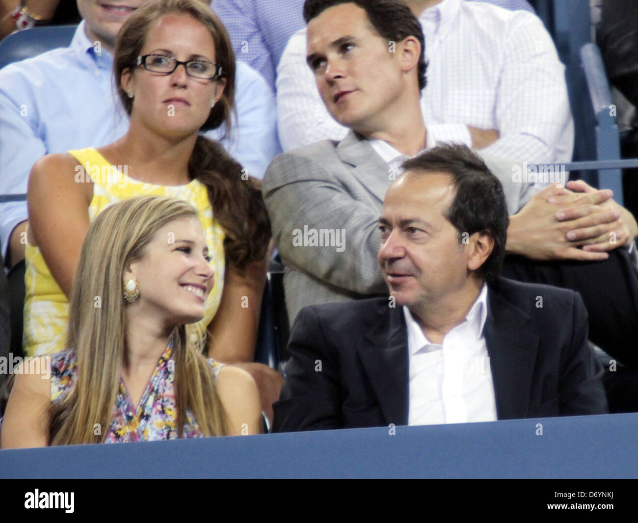 John Paulson watches Maria Sharapova of Russia play against Anastasiya Yakimova of Belarus during Day Three of the 2011 US Open Stock Photo