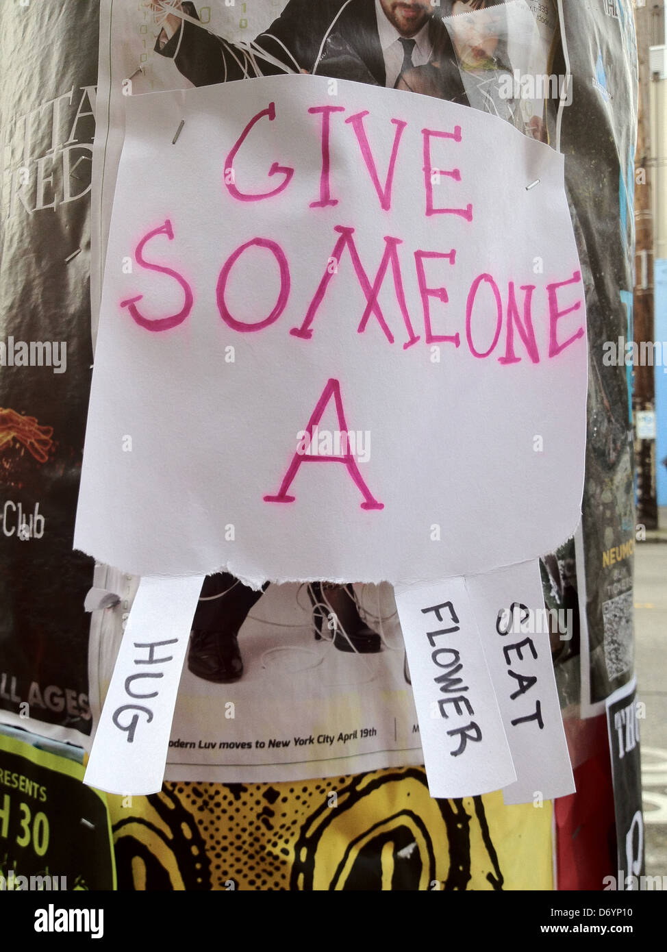 Sign reading 'Give someone a' with tabbed options - Smartphone Captured Stock Image