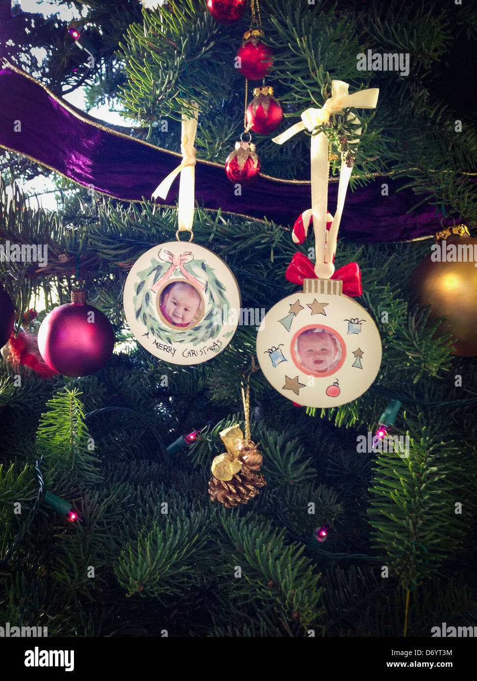 Photos of mixed race girls on Christmas ornaments - Smartphone Captured Stock Image