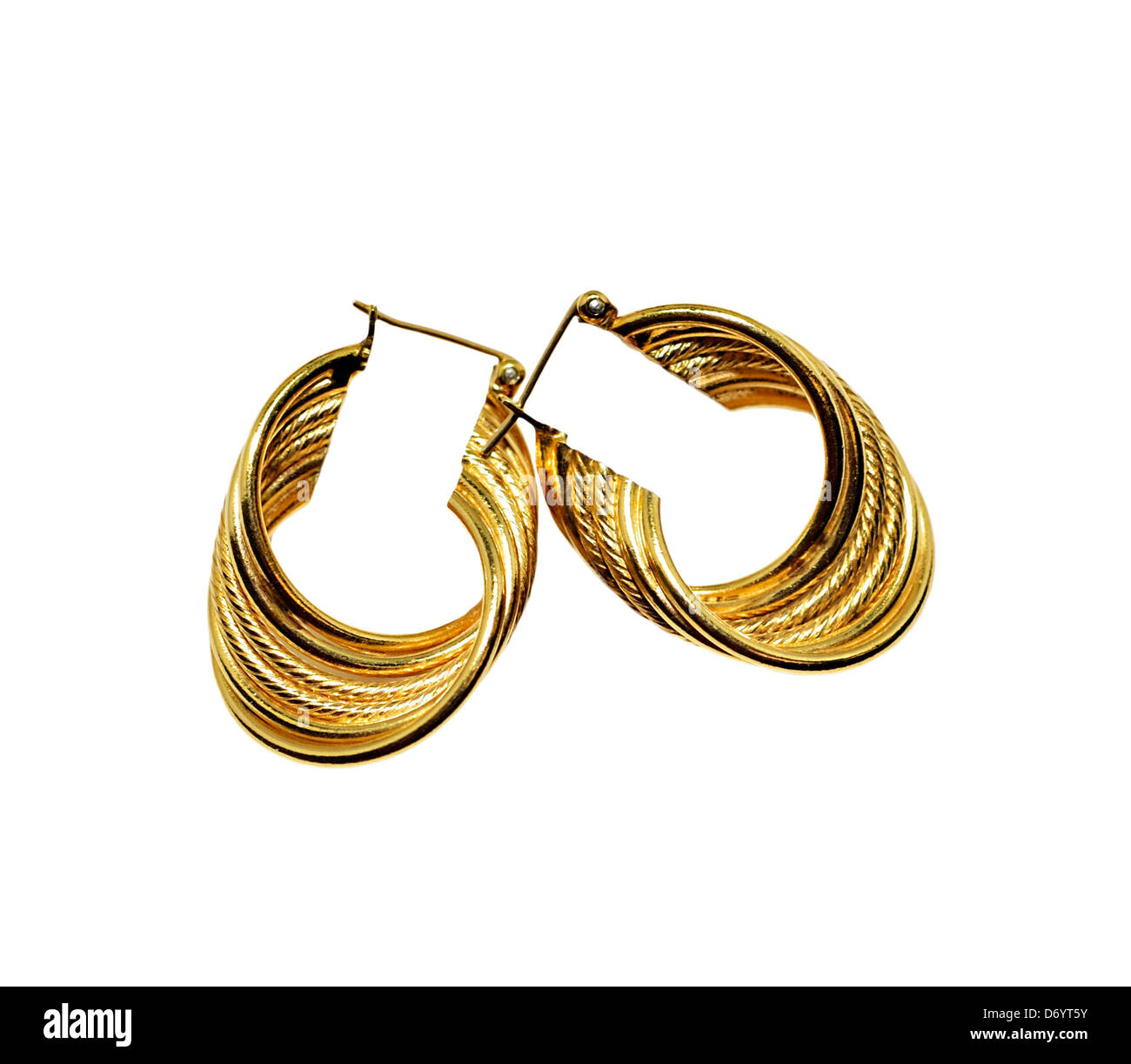 Stylish round gold earrings on white background. Stock Photo