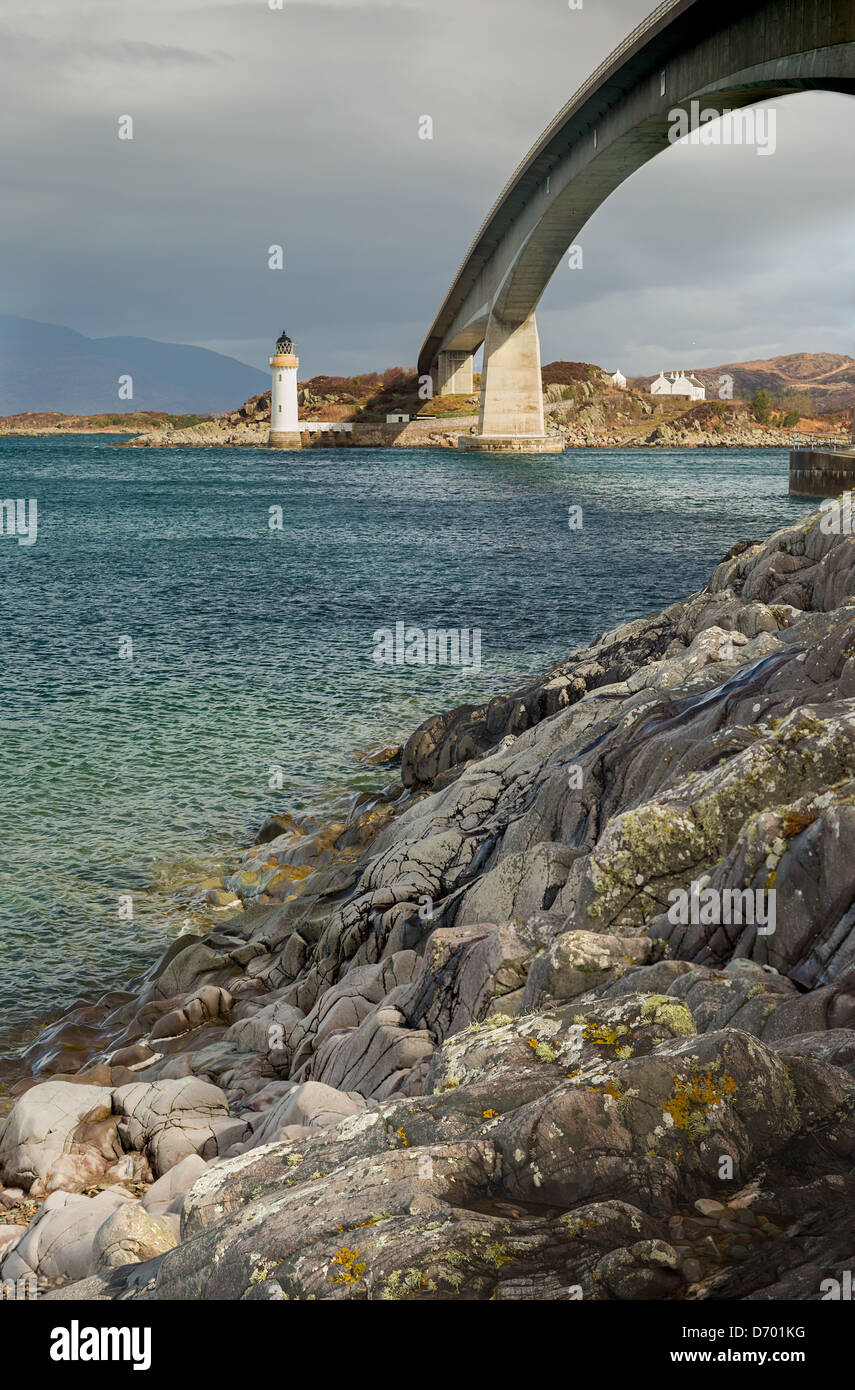 A view of the Skye Road Bridge and the lighthouse on Eilean Ban taken from the Isle of Skye looking across the sea. Stock Photo