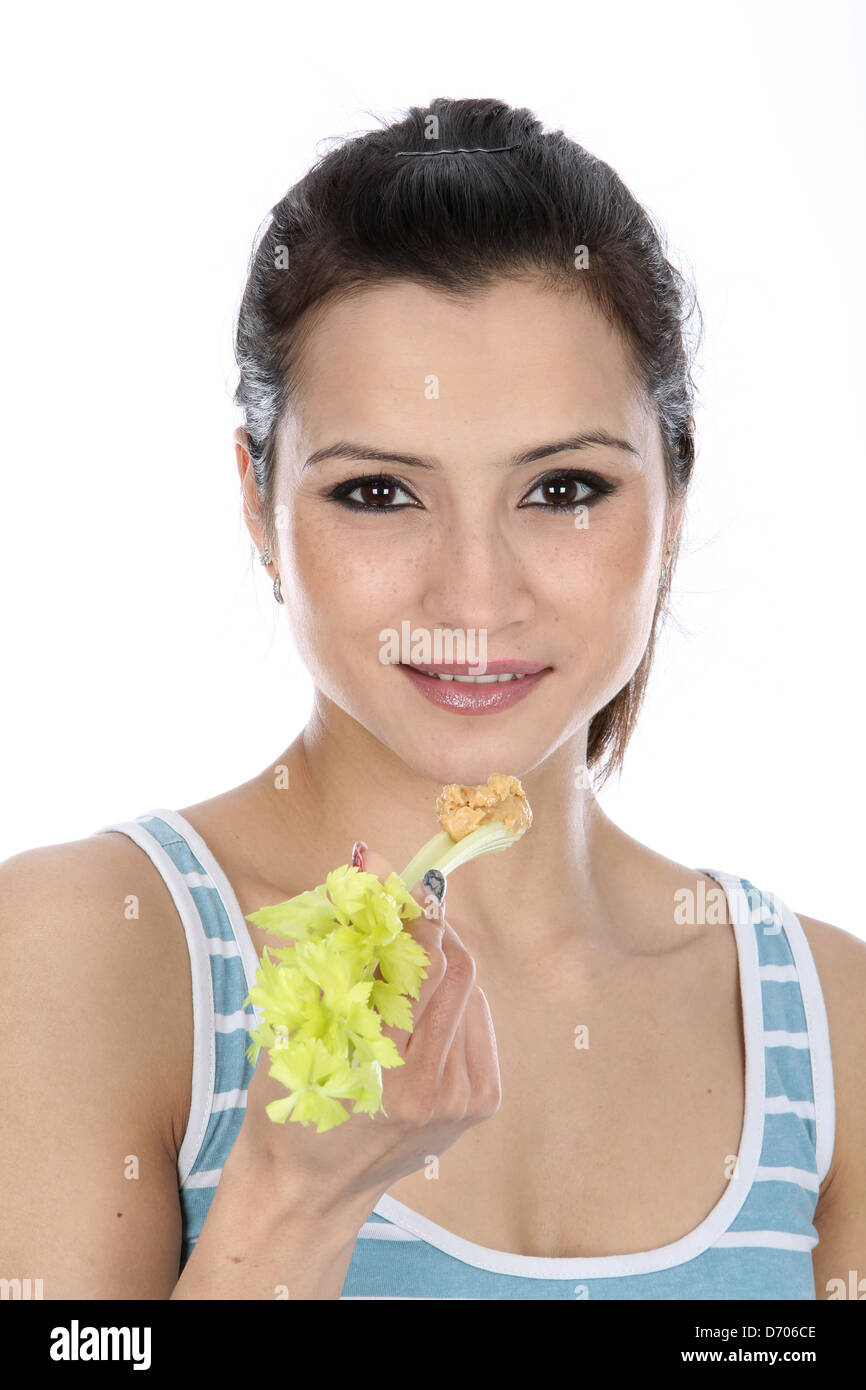 Model Released. Woman Eating Celery and Peanut Butter Stock Photo Alamy