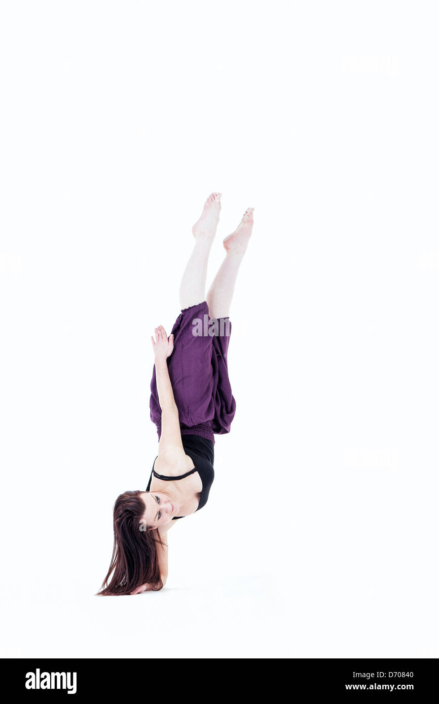 female dancer balancing on one arm Stock Photo