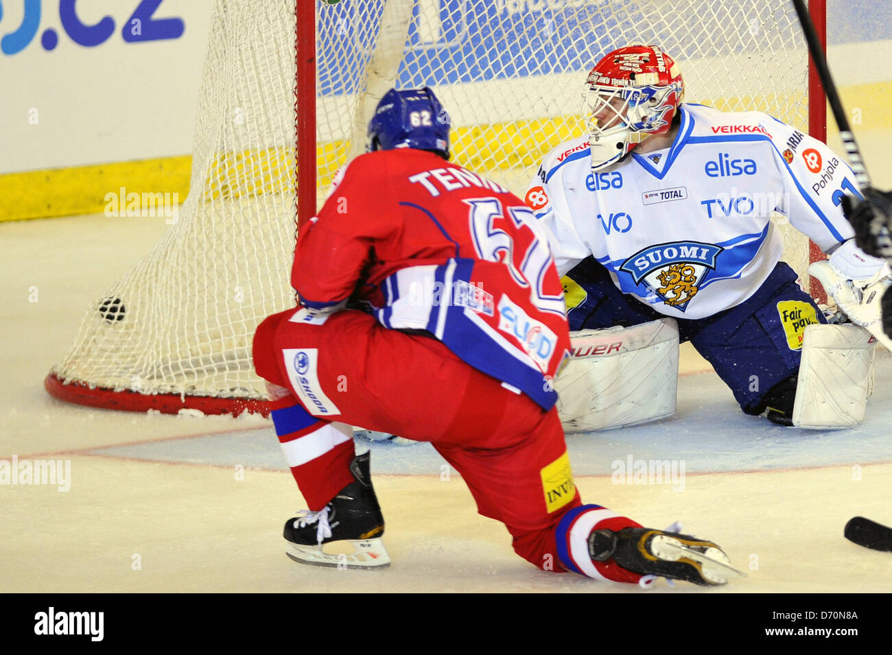 Petr Tenkrat (left) of Czech Republic shots a goal to Joni Ortio of