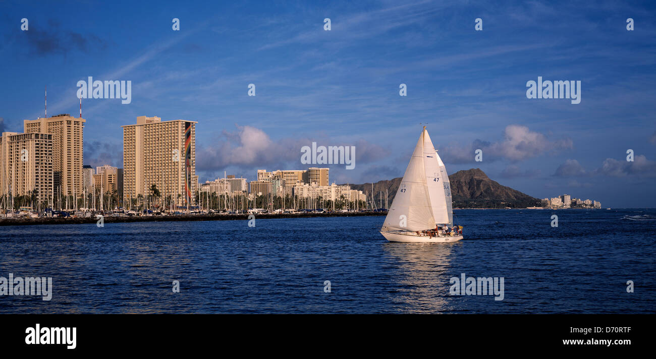Hawaii. Honolulu. Waikiki waterfront skyline with sailing boat Stock