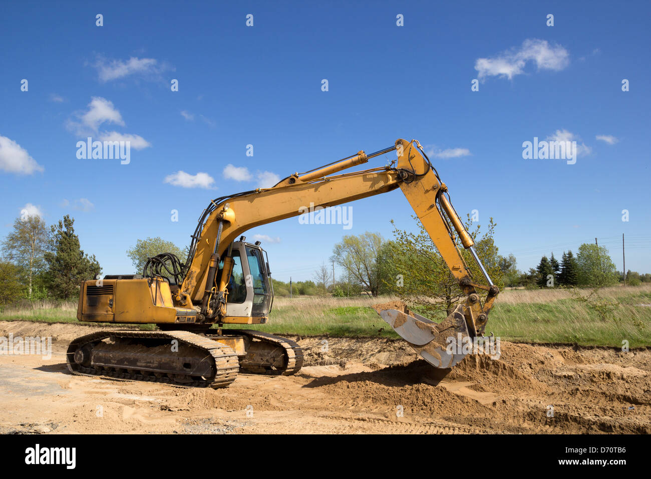 excavator working on a construction site Stock Photo - Alamy