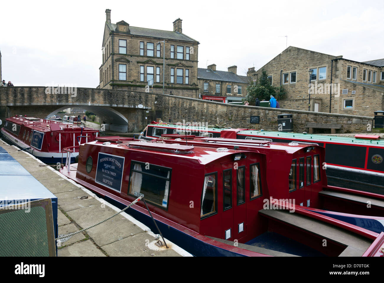 Narrow Boats Barges on Skipton Leeds and Liverpool canal on the river Aire barge boats moored