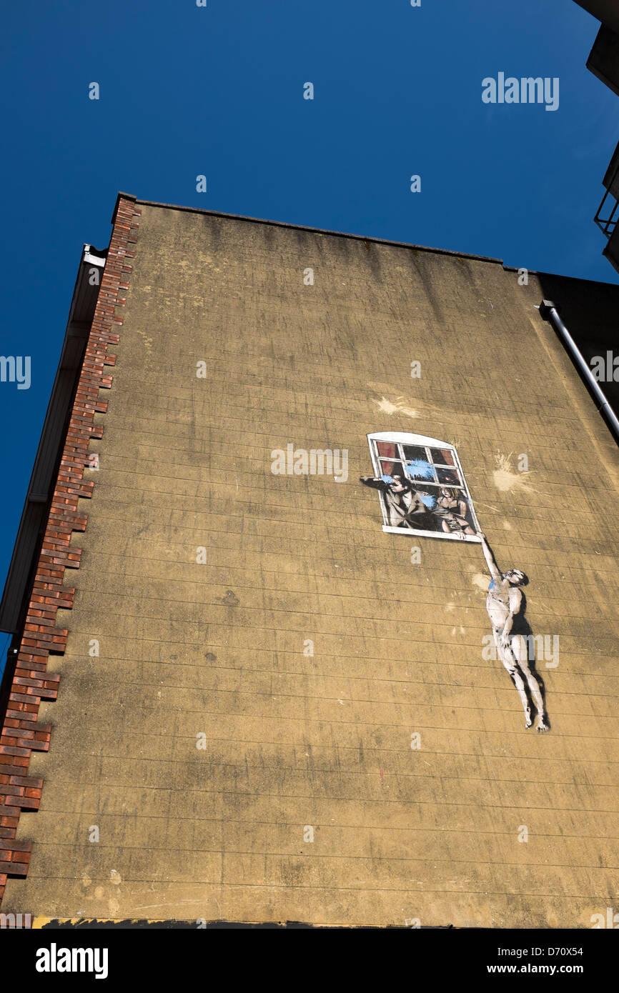 Banksys Hanging Man or Love Cheat Mural Stock Photo