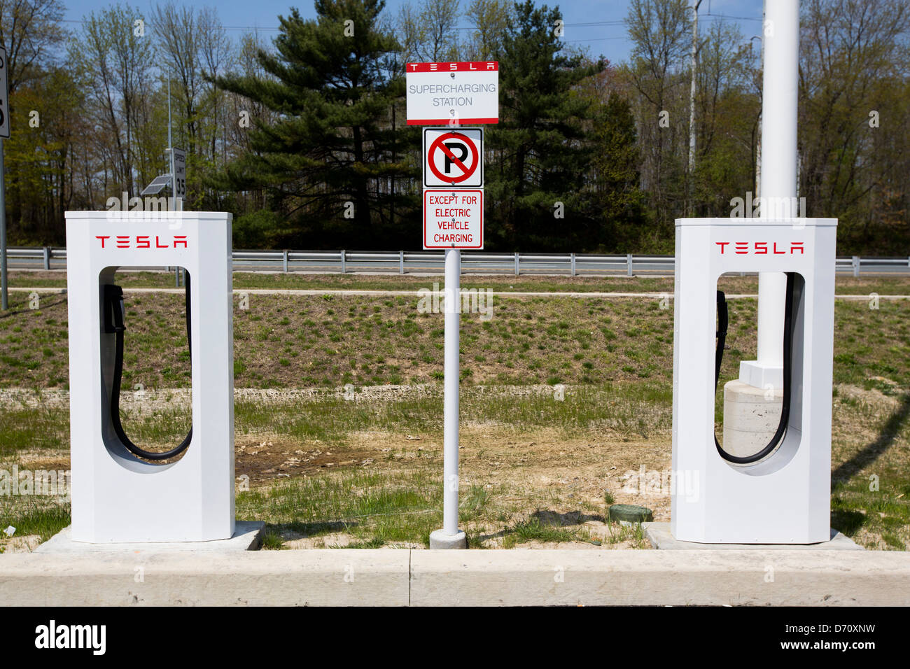 A Tesla electric vehicle Supercharging Station along Interstate 95 in Delaware.  Stock Photo