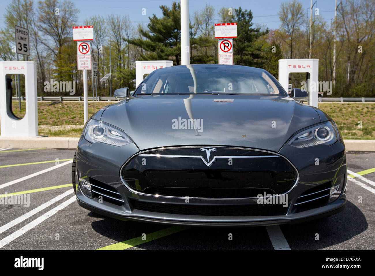 A Tesla Model S electric car Supercharging Station along Interstate 95 in Delaware.  Stock Photo