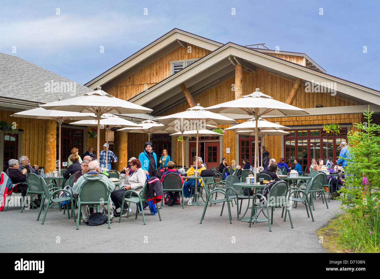 Tourists enjoy the outdoor cafe at Denali National Park Visitors Center, Denali National Park, Alaska, USA Stock Photo