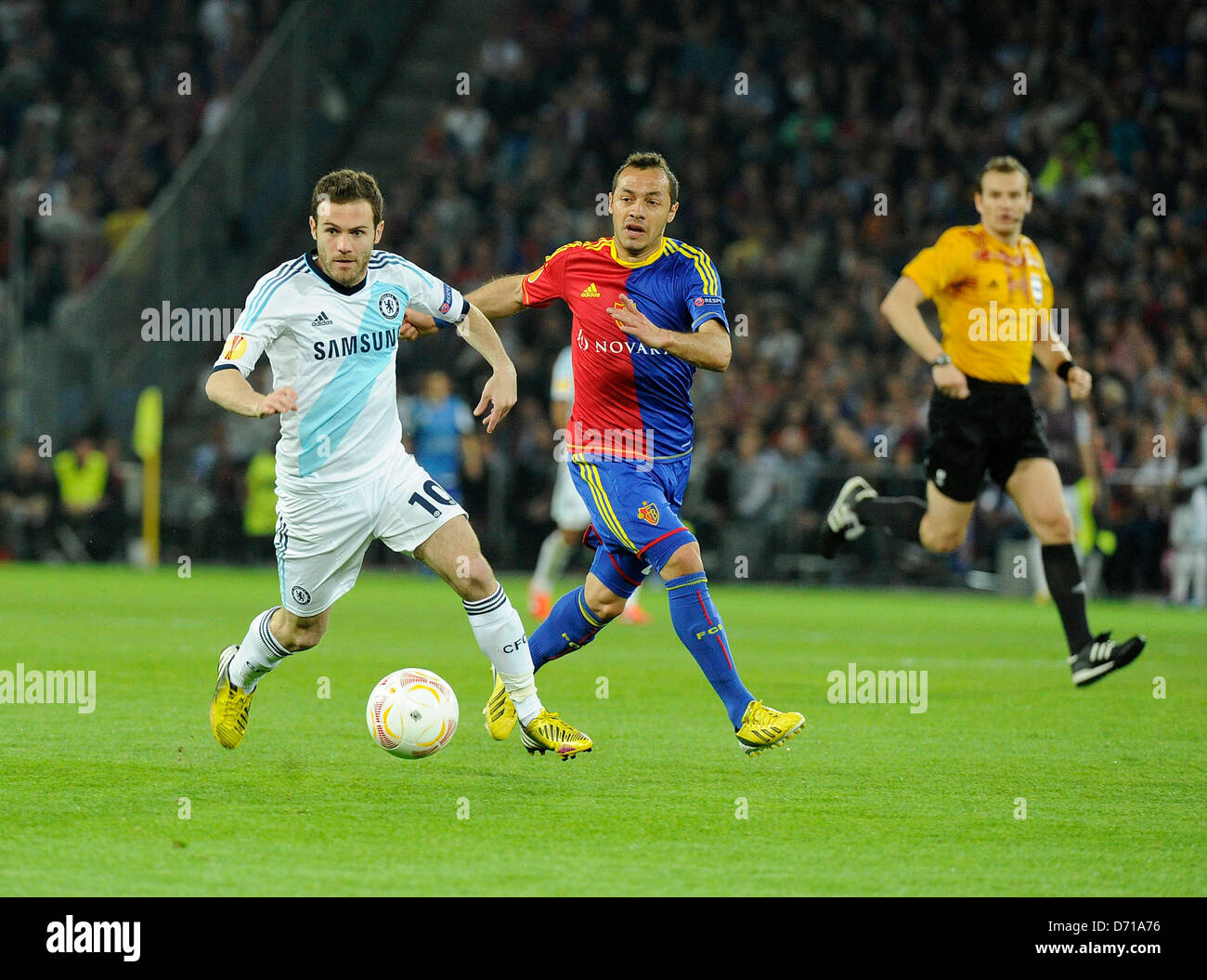 Basel, Switzerland. 25th April, 2013. Juan Mata of Chelsea and Marcelo Diaz of FC Basel in action during the Europa League Semi Final 1st Leg game between FC Basel and Chelsea from St. Jakob-Park. Stock Photo