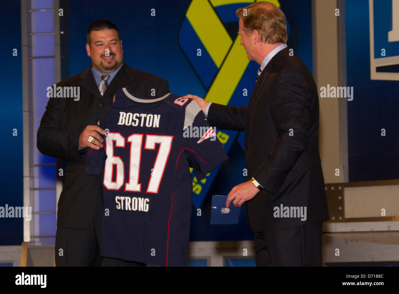April 25, 2013: Former New England Patriots Joe Andruzzi holds up a  ''Boston Strong Patriot Jersey with NFL commissioner Roger Goodell during  the 78th National Football League Draft at Radio City Music