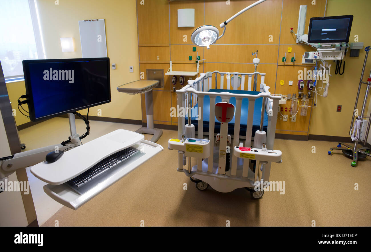 Computer Work Station Bed and medical equipment in Childrens Hospital Medical Recovery Room Stock Photo