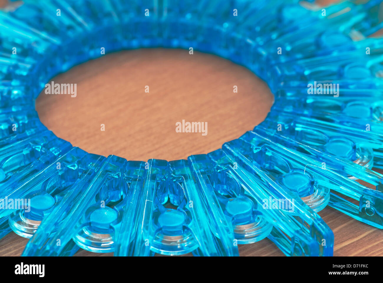 Clothes pegs in the form of a circle. Stock Photo