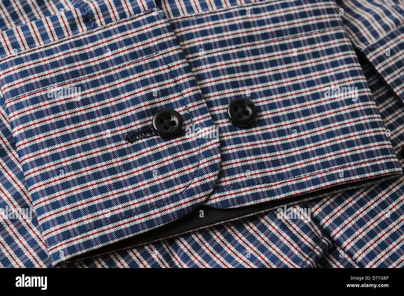 Shirt sleeve buttons Stock Photo - Alamy
