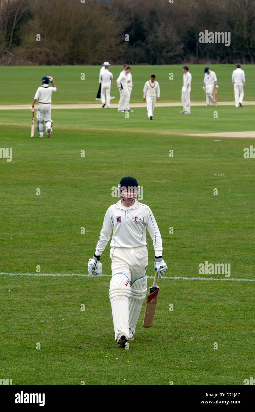 University sports, cricket, batsman out leaving pitch. Stock Photo