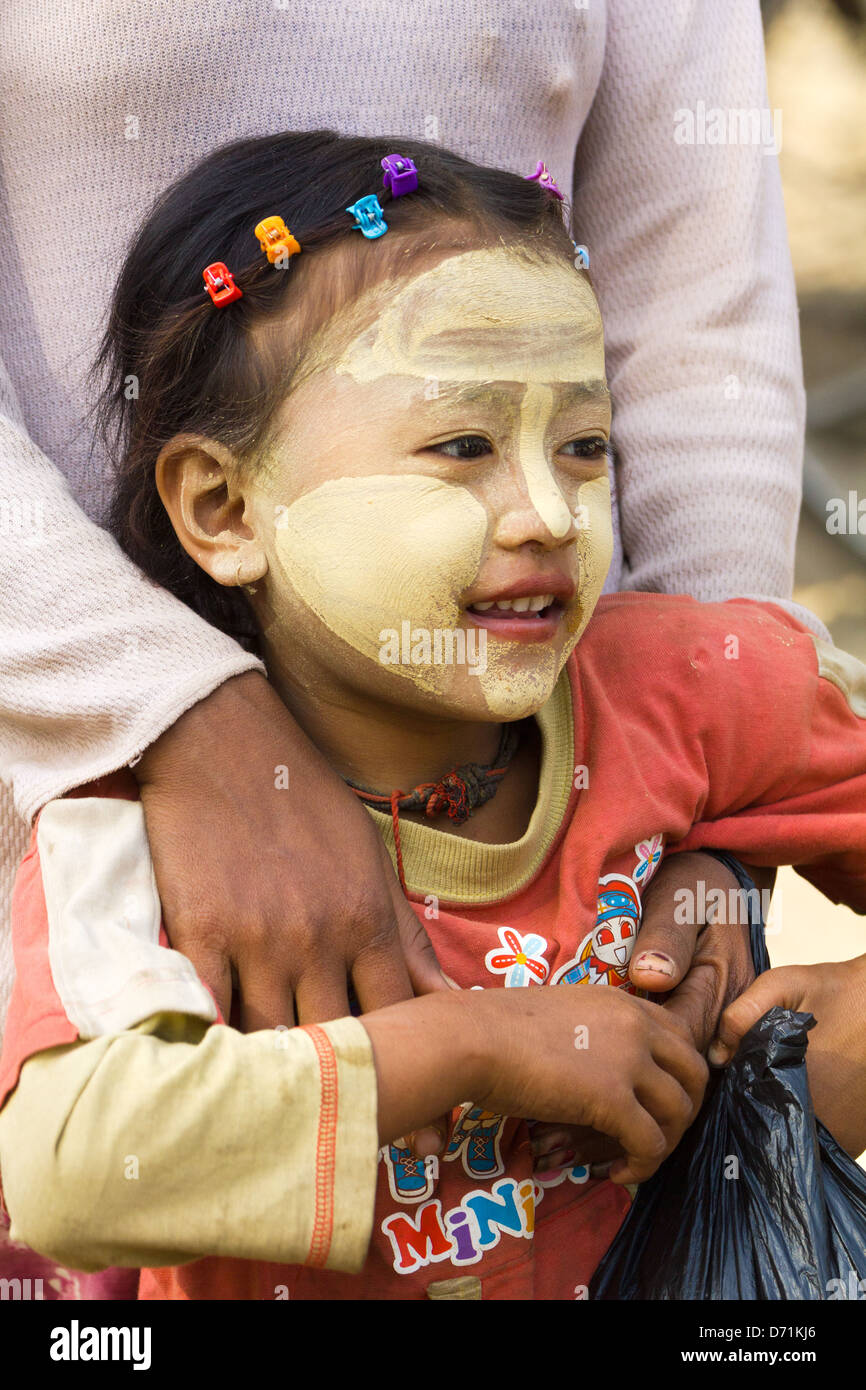 Little girl with Thanaka makeup in Nyaung oo Market in Bagan, Myanmar 3 Stock Photo