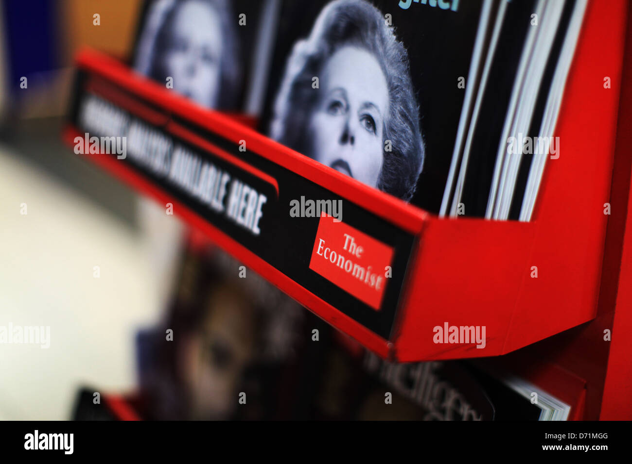 View of International Airport magazine rack featuring The Economist and picture of Margaret Thatcher Stock Photo