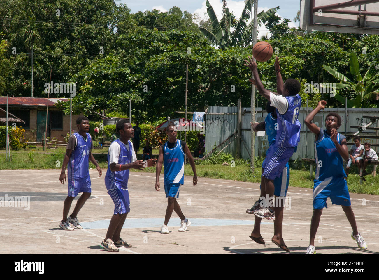 Young men of Papua New Guinea playing basketball in the provincial town