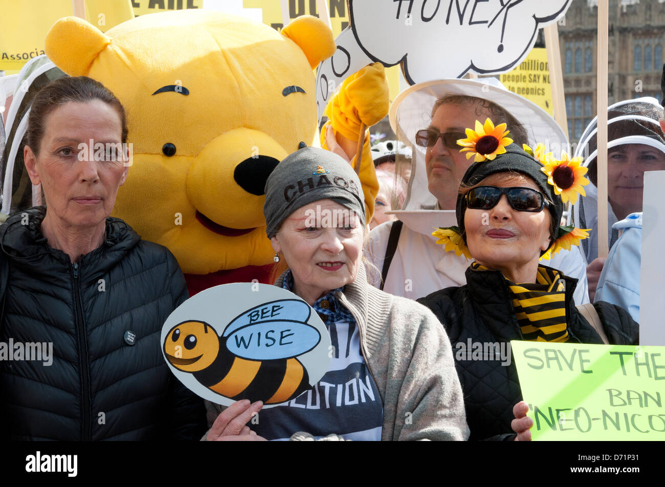 London, UK. 26th April 2013.  Designers Katherine Hamnett CBE (left) and Dame Vivienne Westwood, (centre) join beekeepers and fancy dressed supporters take to Parliament Square to call for a European ban on neonicotinoid pesticides. Organisers hope to persuade Rt Hon Owen Paterson MP, Secretary of State for Environment and Rural Affairs, to support a EU vote banning the bee harming neonicotinoid pesticides on Monday 29th April. Stock Photo