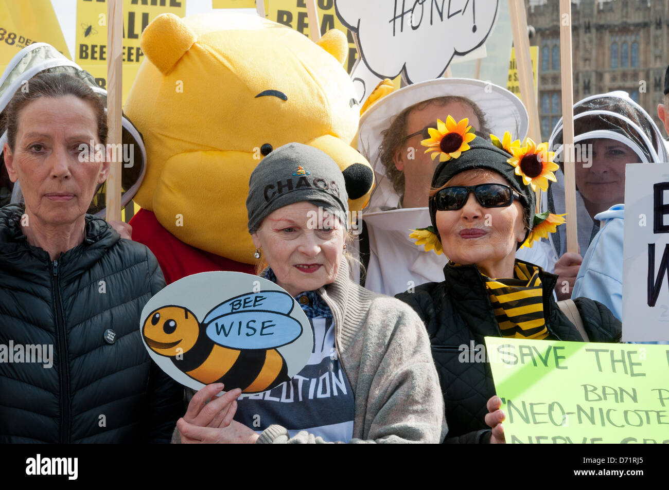 London, England UK 26/04/2013. Designers Katharine Hamnett CBE ( left) and Dame Vivienne Westwood (second left) join beekeepers and fancy dressed supporters take to Parliament Square to call for a European ban on neonicotinoid pesticides. Organisers hope to persuade Rt Hon Owen Paterson MP, Secretary of State for Environment and Rural Affairs, to support a EU vote banning the bee harming neonicotinoid pesticides on Monday 29th April. Stock Photo