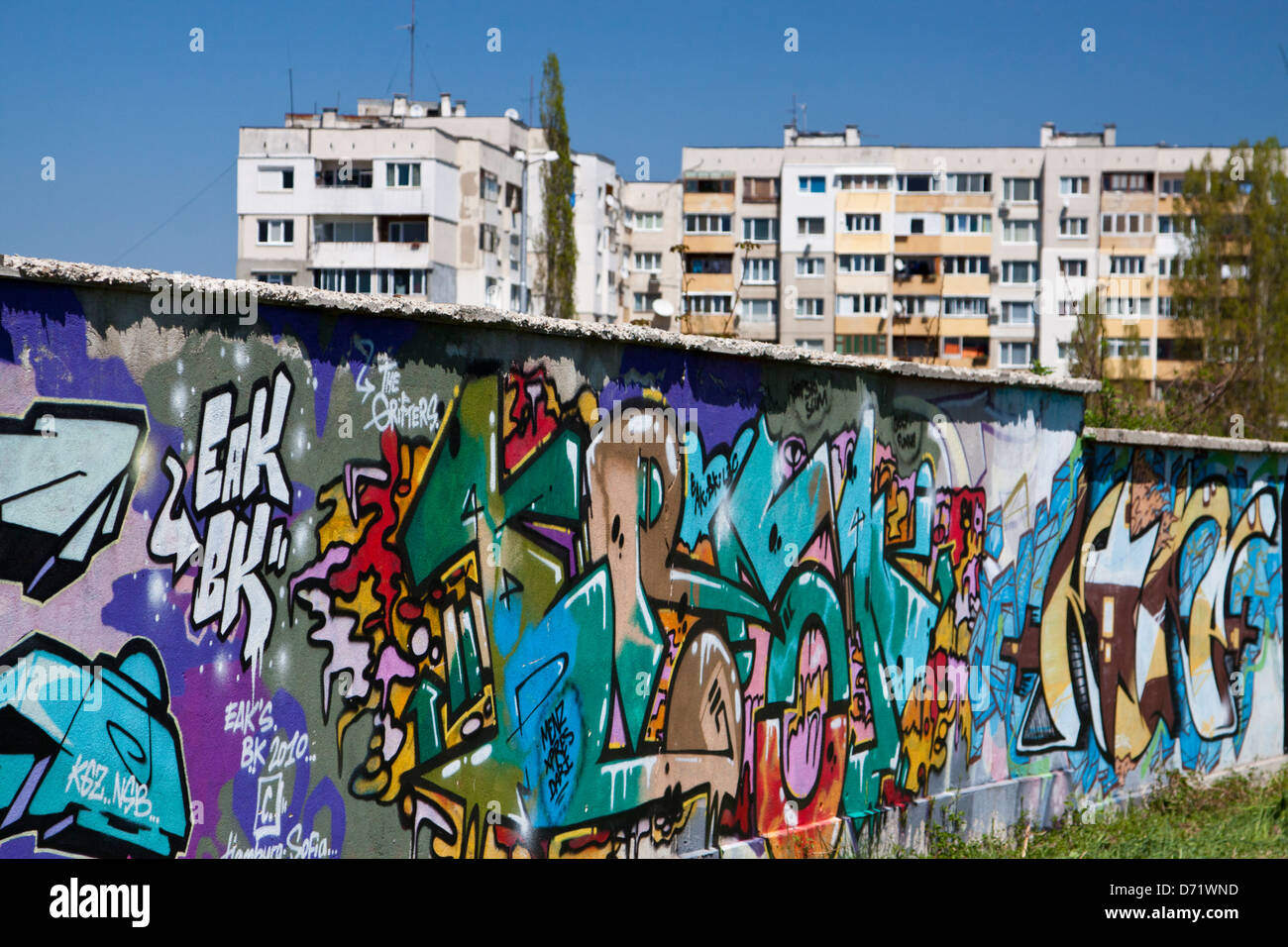 Wall covered with graffiti, apartment blocks of Sofia's Druzhba 2 district  in the background Stock Photo - Alamy