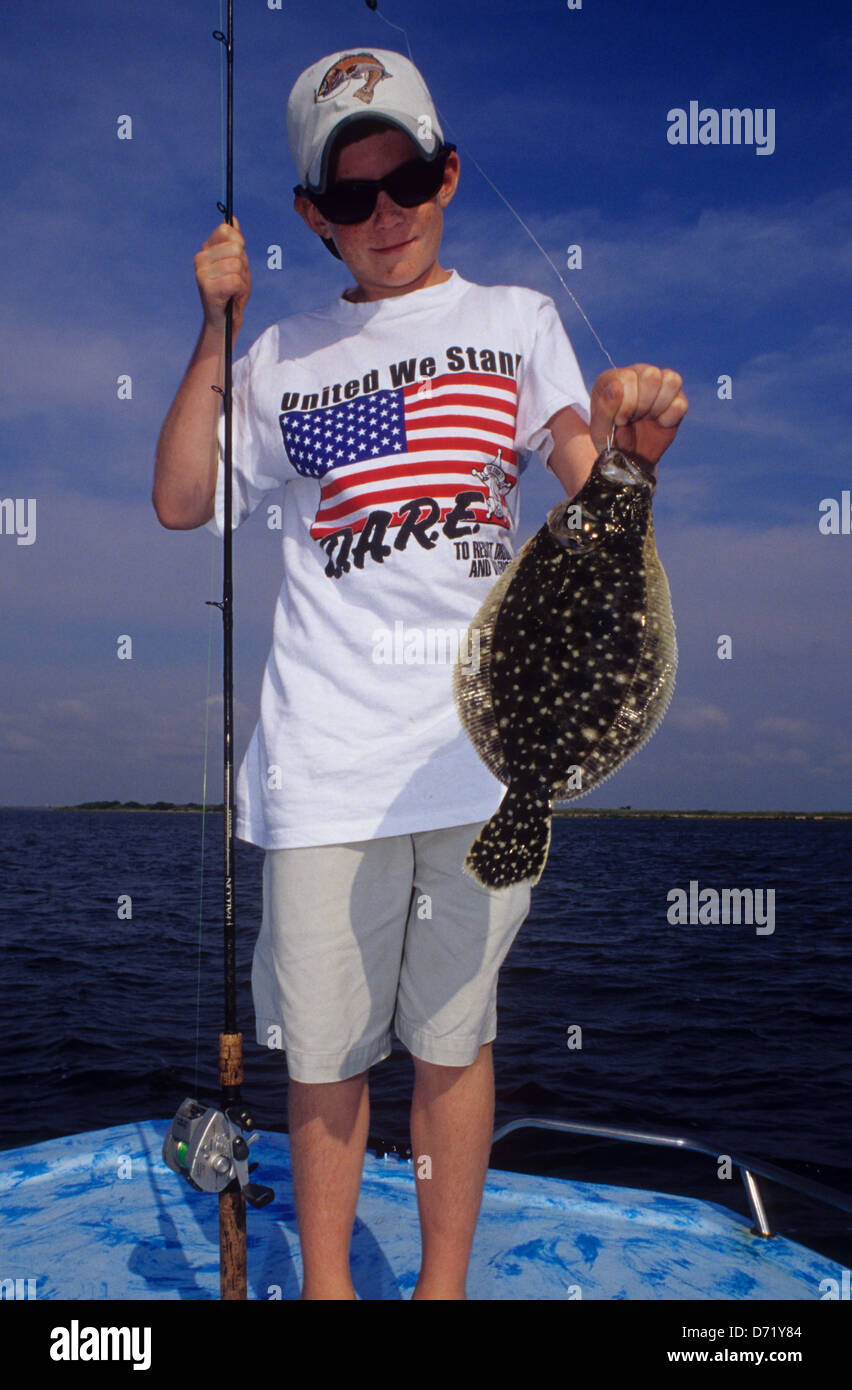 https://c8.alamy.com/comp/D71Y84/a-young-boy-with-a-gulf-flounder-paralichthys-albiguttata-caught-near-D71Y84.jpg