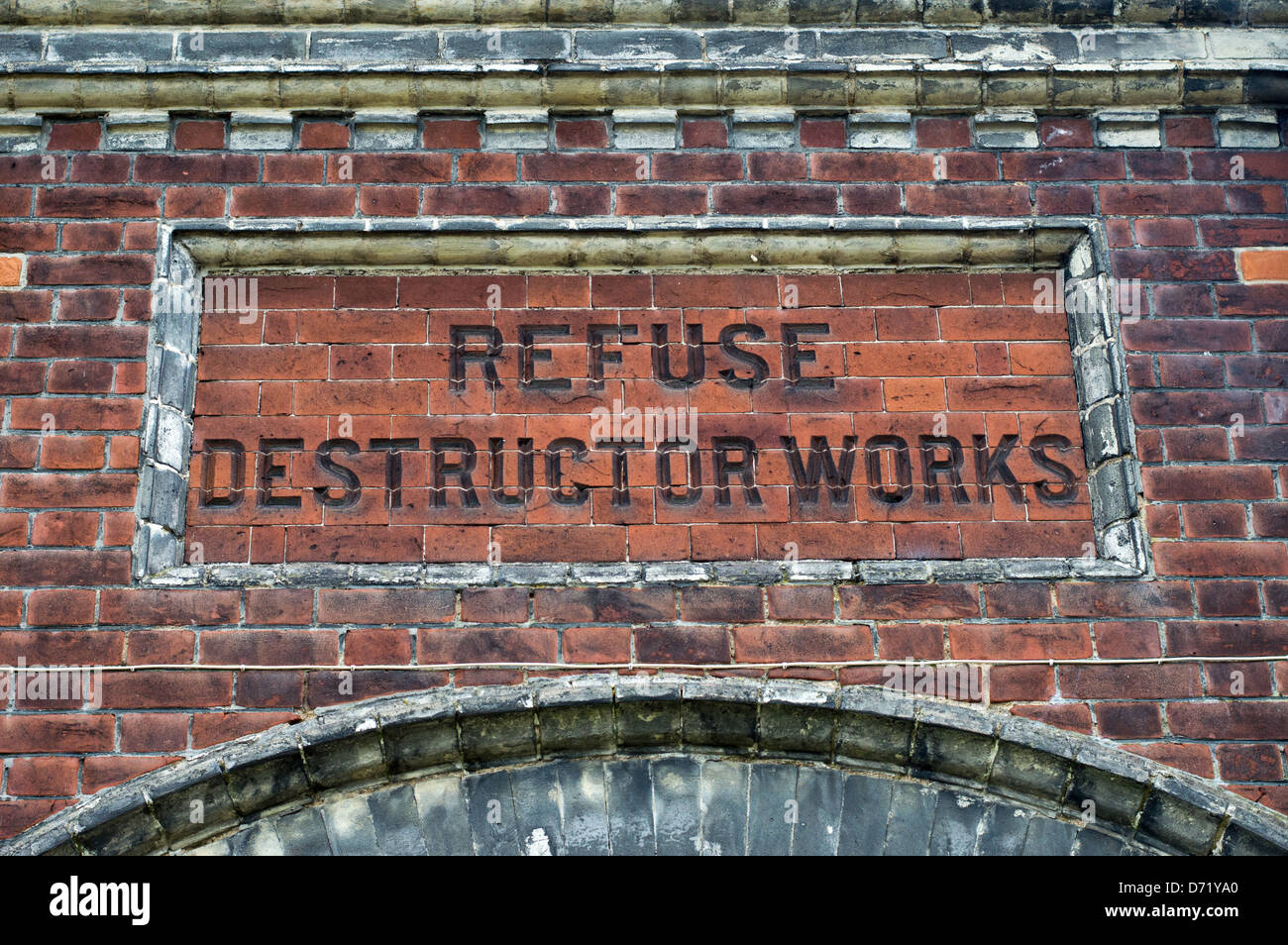 The words Refuse Destructor Works chiseled into brickworks of an old public utility building. Stock Photo