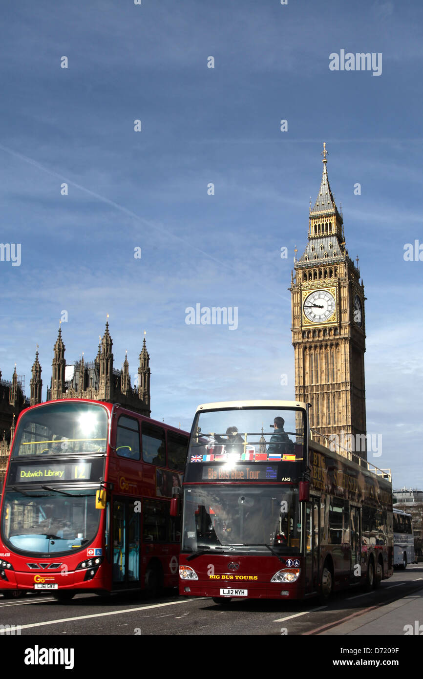 London sight seeing bus crossing Westminster bridge, with houses of Parliament. Stock Photo