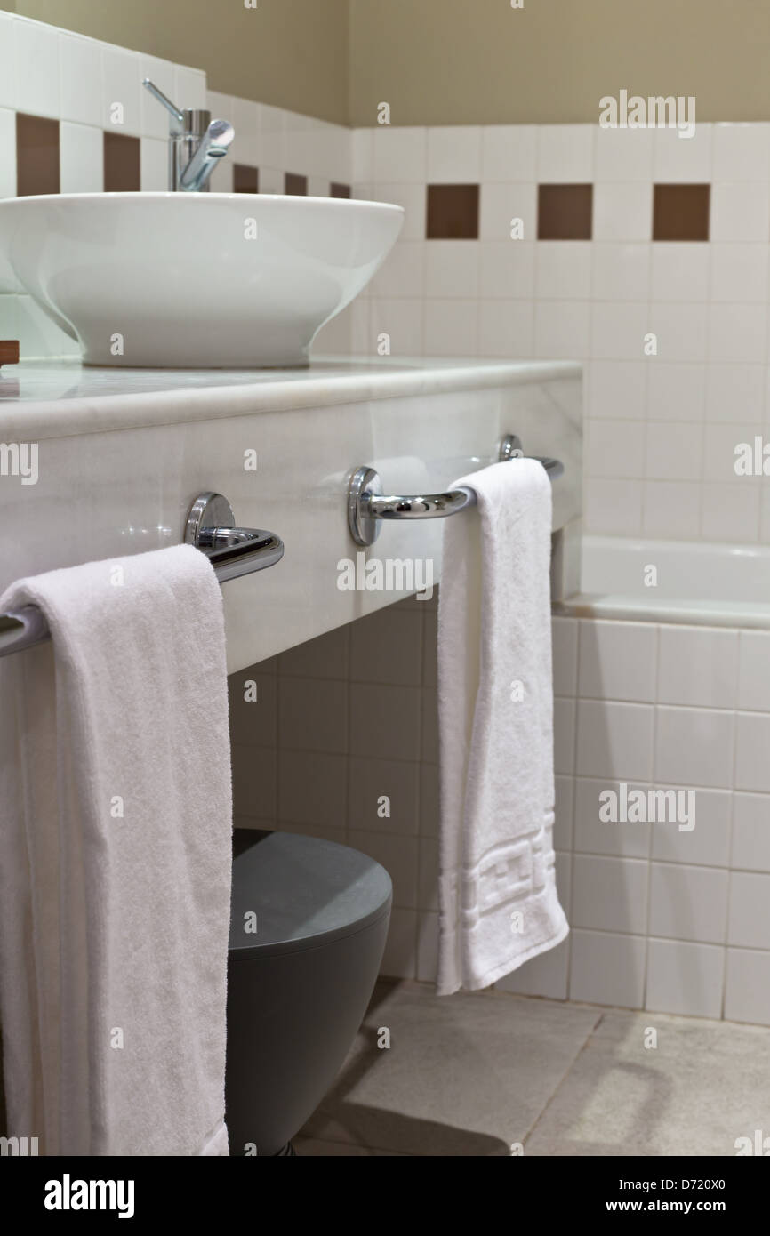 Hotel Bathroom in White Tones. Vertical Shot Stock Photo