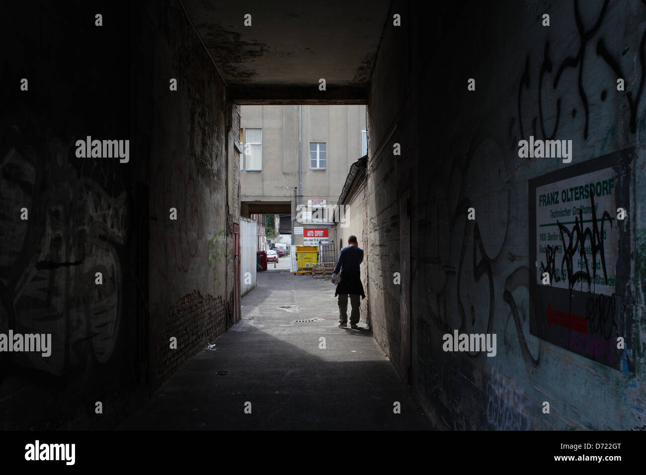 Berlin, Germany, a man phoning in a drivethrough to a backyard Stock
